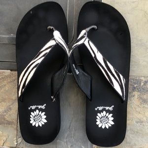 Yellow Box zebra print flip flops, size 7.